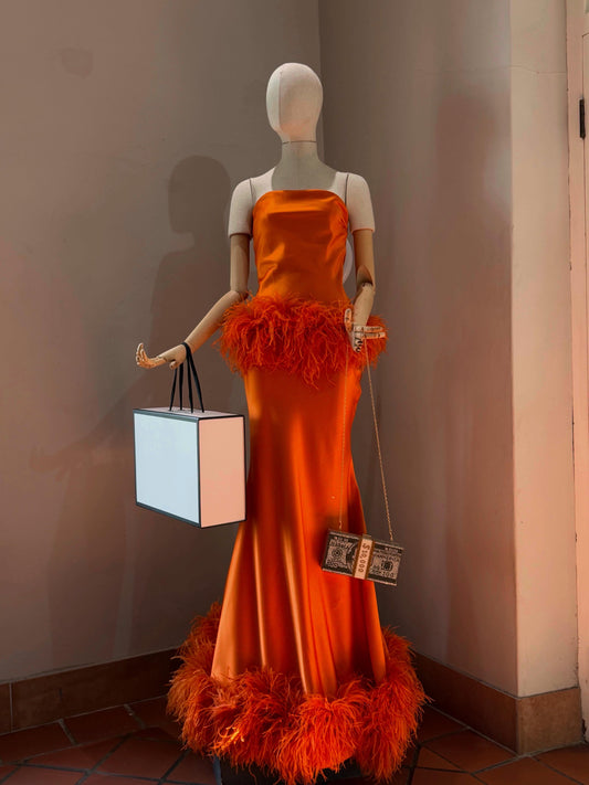 The Plume Dress in Orange - strapless orange satin column gown with ostrich-feather trim at the hip and hem, front view